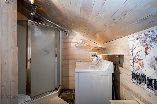 laundry area featuring laundry area, wood walls, independent washer and dryer, and wood ceiling