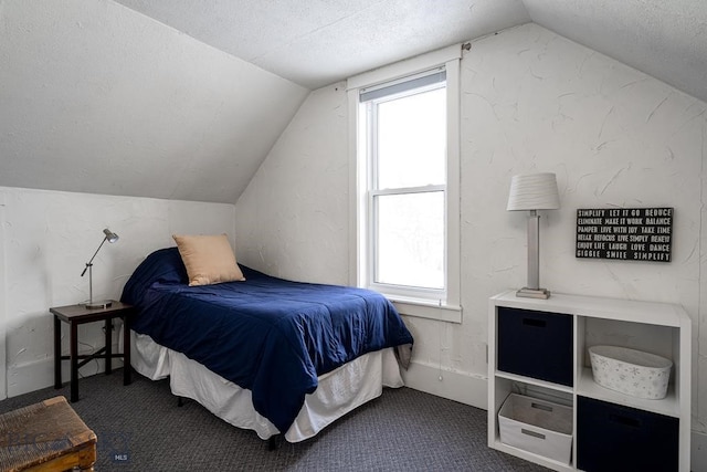 carpeted bedroom with lofted ceiling and a textured ceiling