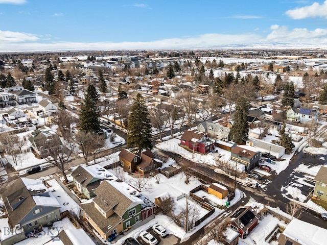 snowy aerial view with a residential view