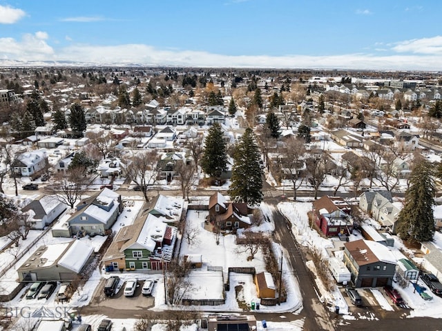 snowy aerial view featuring a residential view