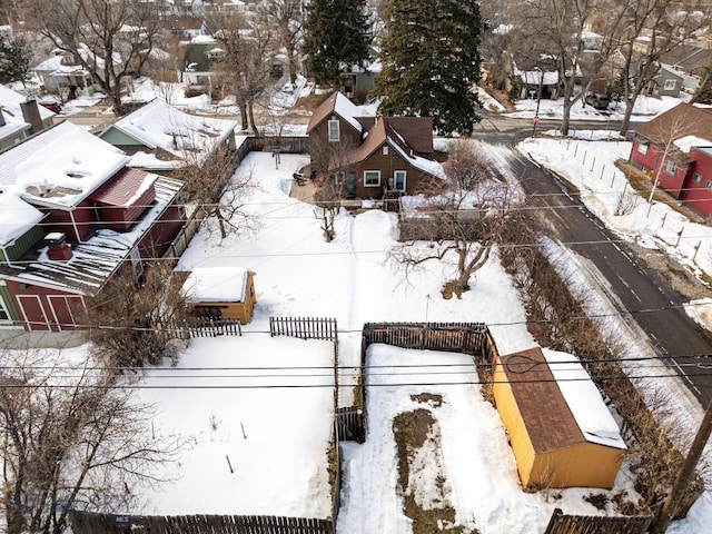 snowy aerial view featuring a residential view