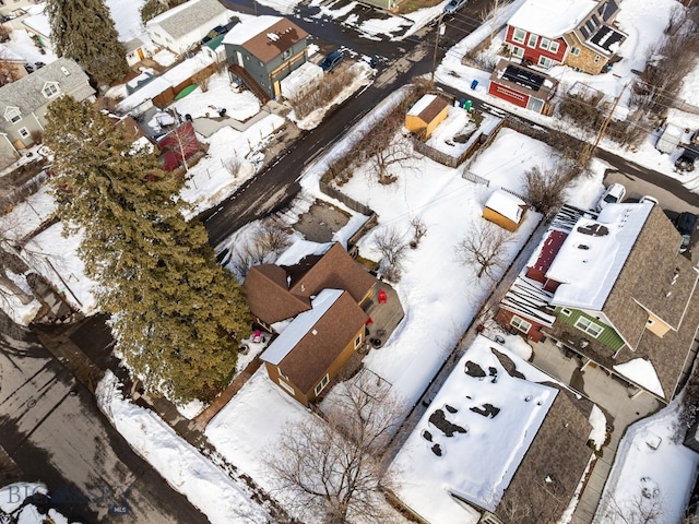 snowy aerial view featuring a residential view