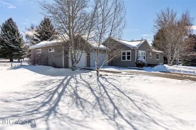 single story home with a garage