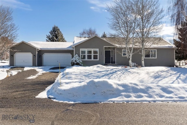 ranch-style home featuring an attached garage