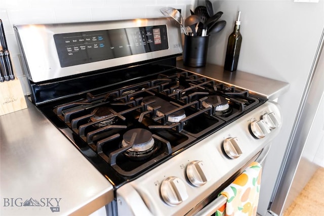 room details featuring mail area and stainless steel range with gas stovetop