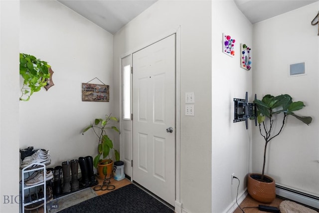 entrance foyer featuring a baseboard radiator and visible vents