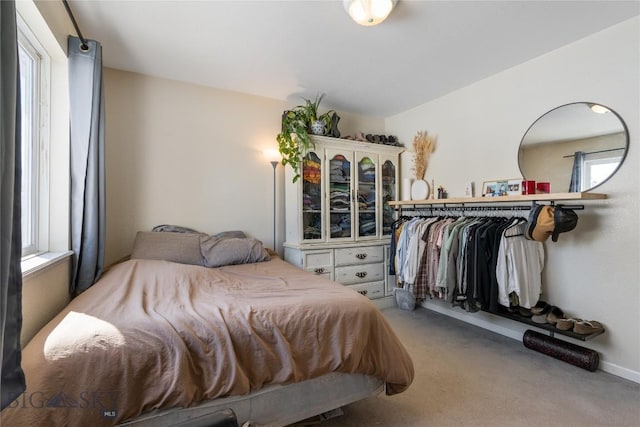 carpeted bedroom with baseboards