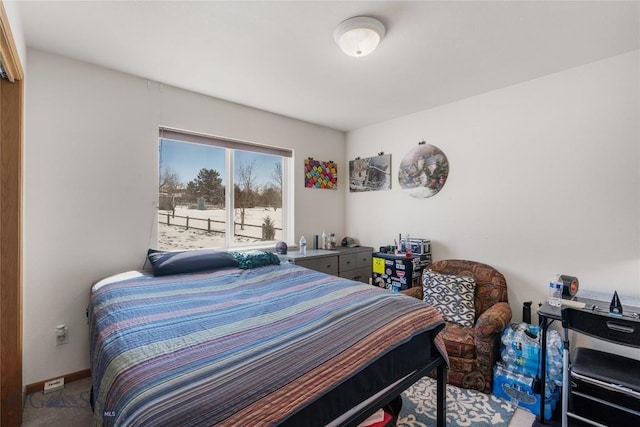 bedroom featuring baseboards