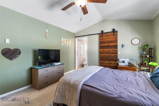 bedroom with light carpet, a barn door, baseboards, and vaulted ceiling