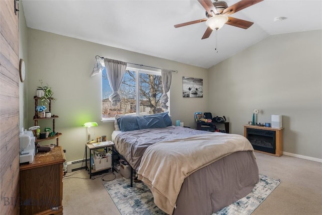 carpeted bedroom with lofted ceiling, ceiling fan, baseboard heating, and baseboards