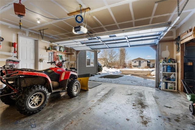 garage featuring a garage door opener