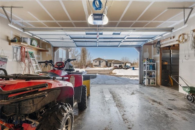 garage featuring a garage door opener