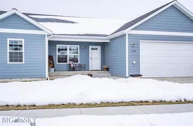 ranch-style home featuring a garage