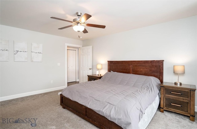 bedroom with light carpet, baseboards, and a ceiling fan