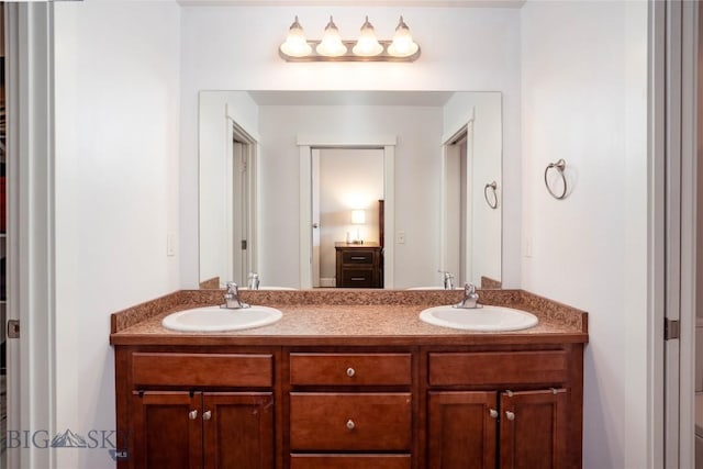 bathroom featuring double vanity and a sink