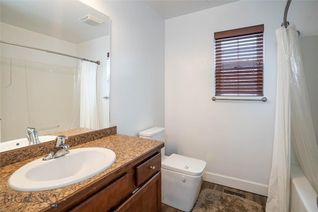 full bathroom featuring baseboards, visible vents, vanity, and toilet