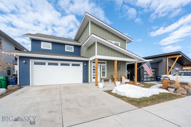 view of front facade with a porch, concrete driveway, board and batten siding, and an attached garage