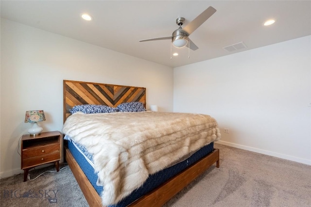 bedroom with carpet floors, recessed lighting, and visible vents