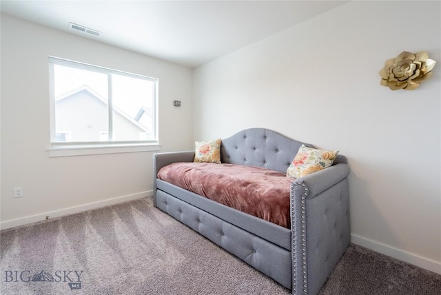 carpeted bedroom with baseboards and visible vents