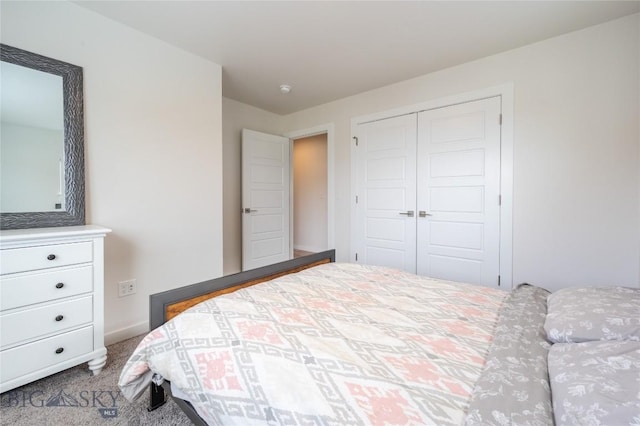 carpeted bedroom featuring a closet