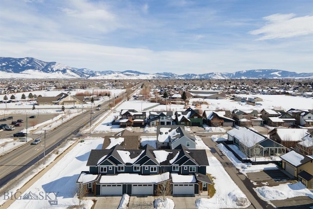 drone / aerial view with a residential view and a mountain view