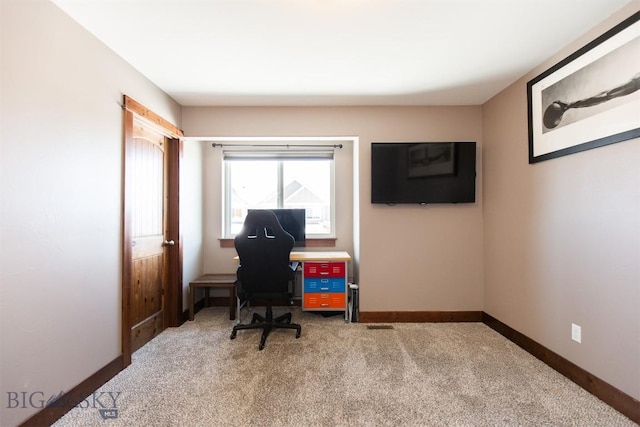 office space featuring carpet and baseboards