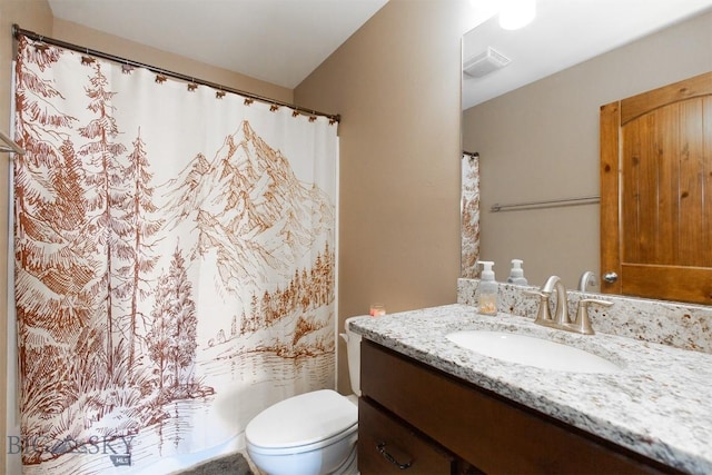 full bath with a shower with curtain, vanity, and toilet