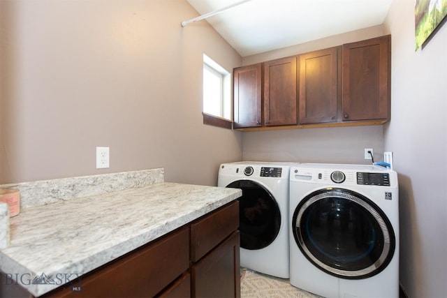 laundry room featuring washer and dryer and cabinet space