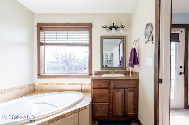 bathroom with a bath and vanity