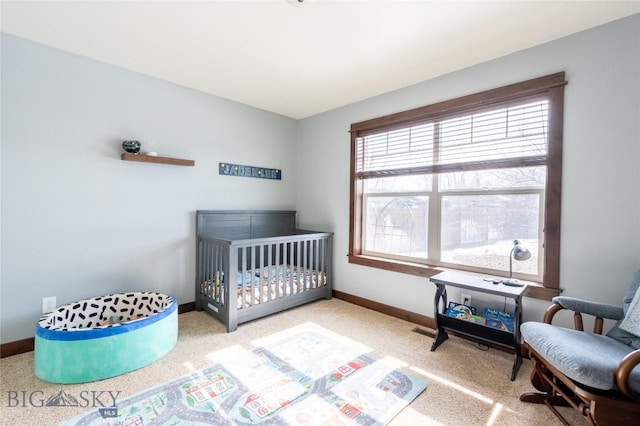 carpeted bedroom with baseboards