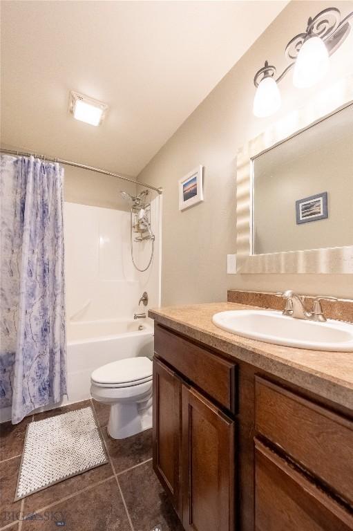 full bath featuring toilet, tile patterned flooring, shower / bathtub combination with curtain, and vanity