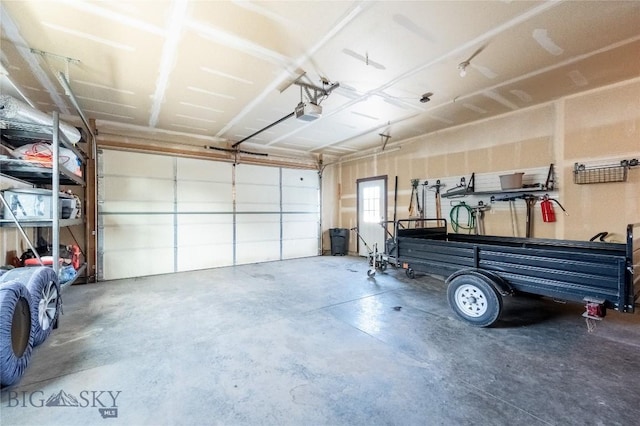 garage featuring a garage door opener