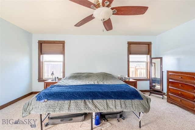 bedroom with ceiling fan, carpet floors, and baseboards