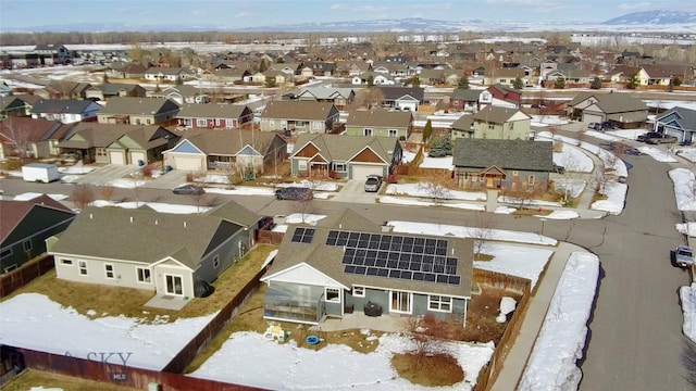 snowy aerial view featuring a residential view