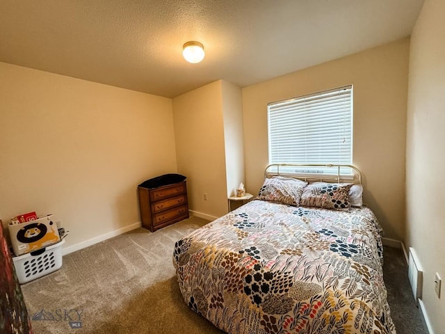 carpeted bedroom with visible vents, baseboards, and a textured ceiling