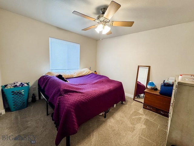 bedroom with carpet, a ceiling fan, and baseboards