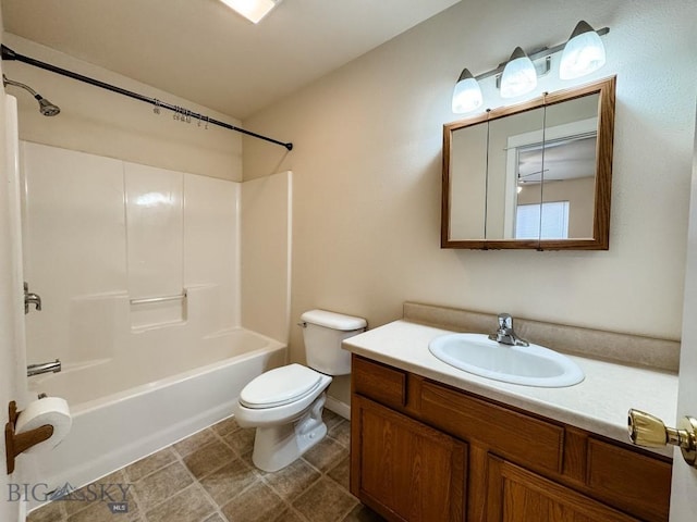 full bath with toilet, vanity, and shower / washtub combination