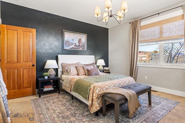 bedroom featuring an accent wall, carpet, a notable chandelier, and baseboards