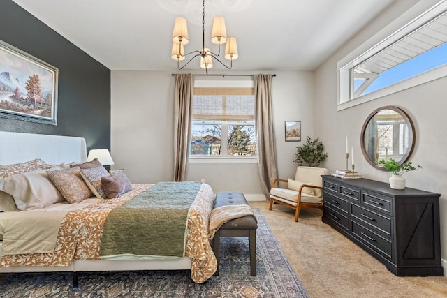 bedroom with an inviting chandelier, baseboards, and light colored carpet