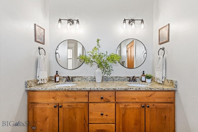 bathroom with a sink and double vanity