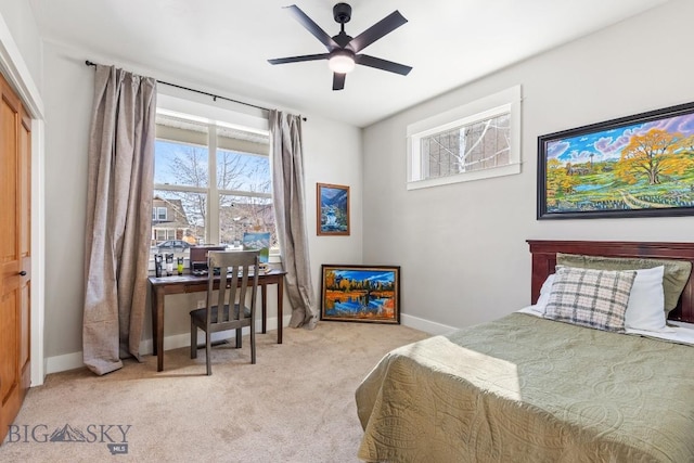 bedroom with baseboards, ceiling fan, and light colored carpet