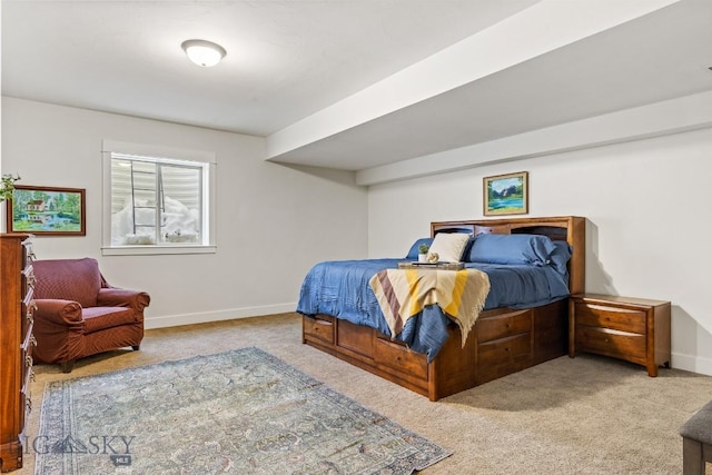 bedroom with carpet floors and baseboards