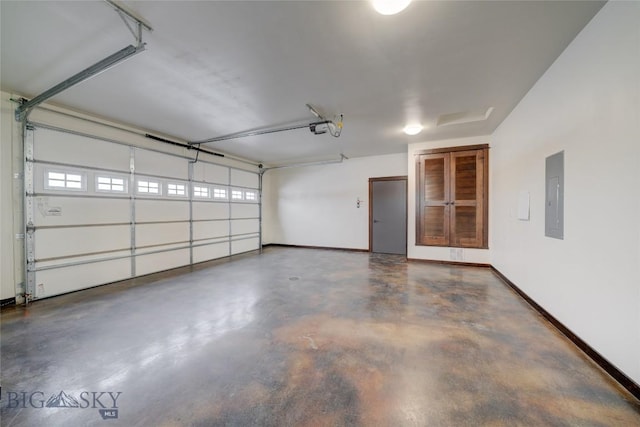 garage with a garage door opener, electric panel, and baseboards