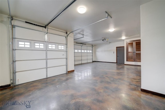 garage featuring baseboards