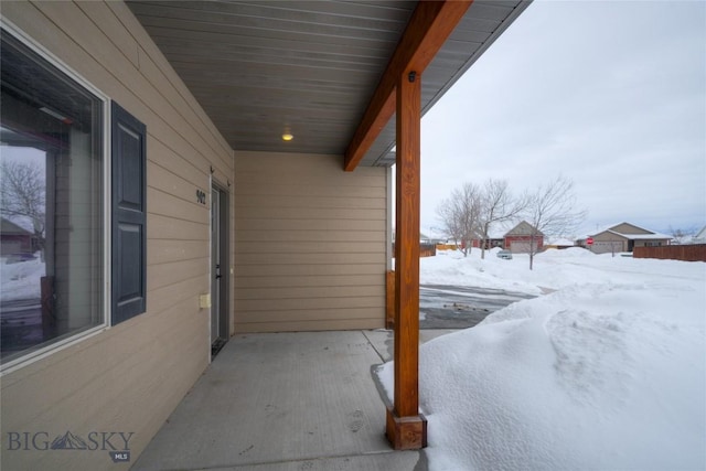 view of snow covered patio