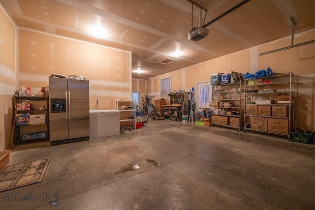 garage featuring stainless steel fridge