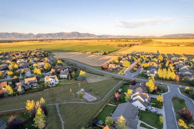 bird's eye view with a residential view, a mountain view, and a rural view