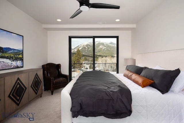 bedroom featuring a ceiling fan, access to outside, recessed lighting, a mountain view, and light colored carpet