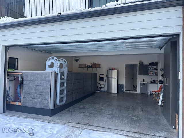 garage with freestanding refrigerator