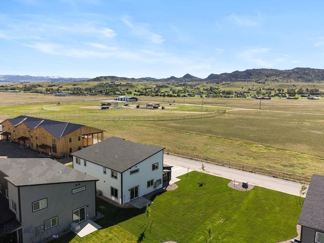 drone / aerial view with a rural view and a mountain view